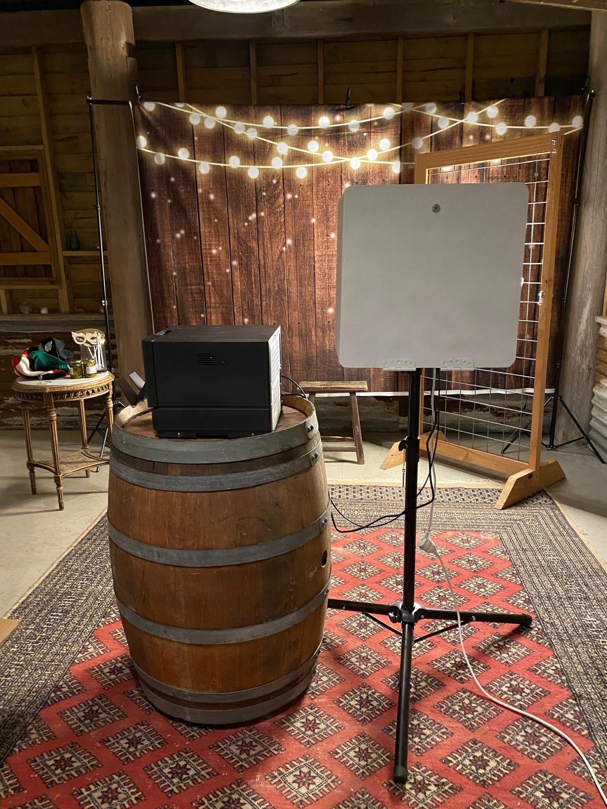 Rustic event photobooth setup with instant printer